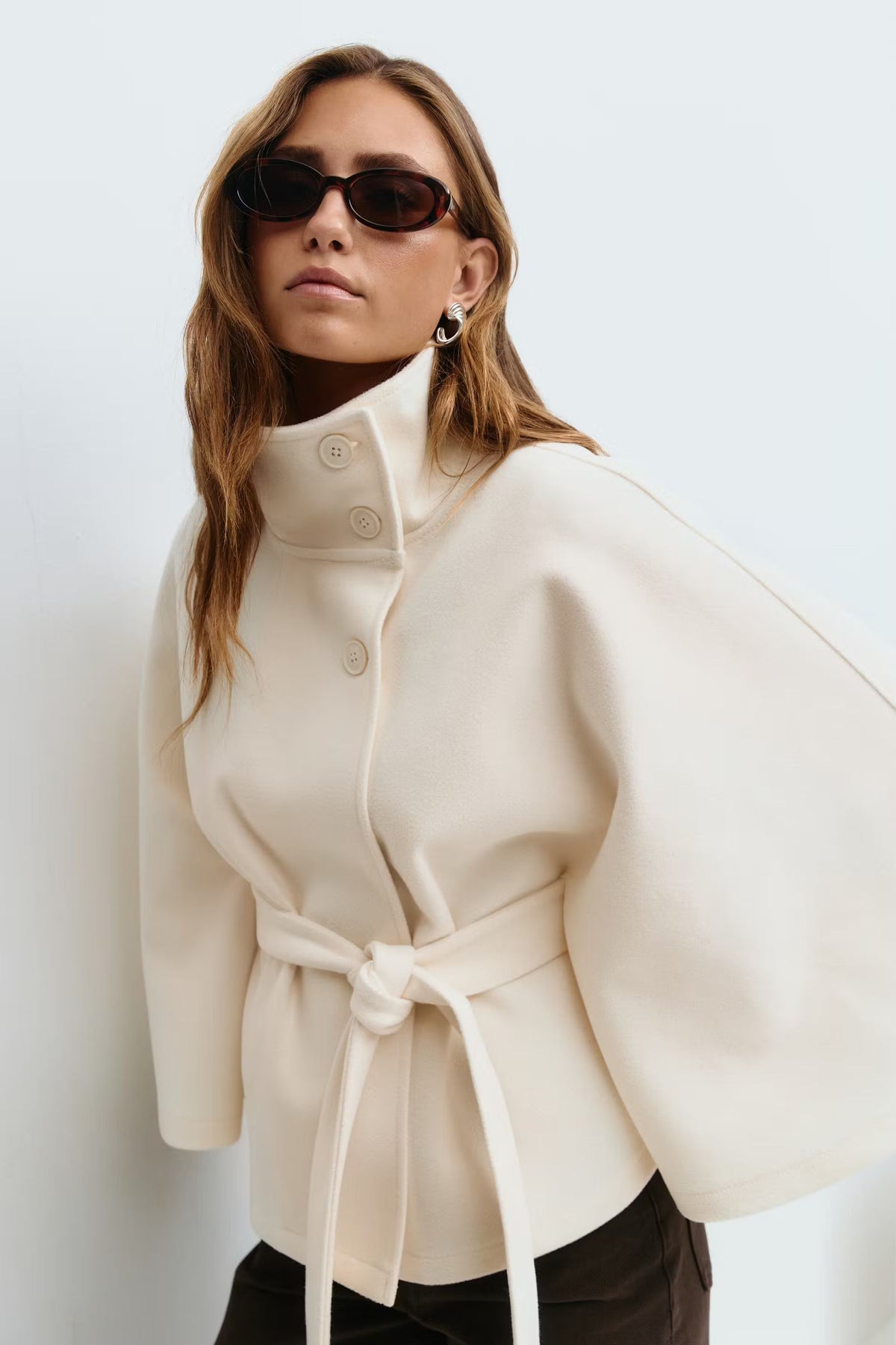 Cape Jas for women featuring a regular fit, high collar, and stylish tie belt, perfect for layering in colder weather. - 1